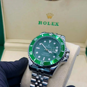 Rolex submariner silver with green rotating dial with date