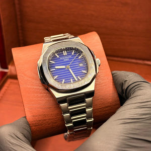 PP silver with blue dial with date