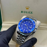 Rolex submariner silver with blue rotating dial with date